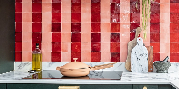 Red and pink zellige kitchen backsplash